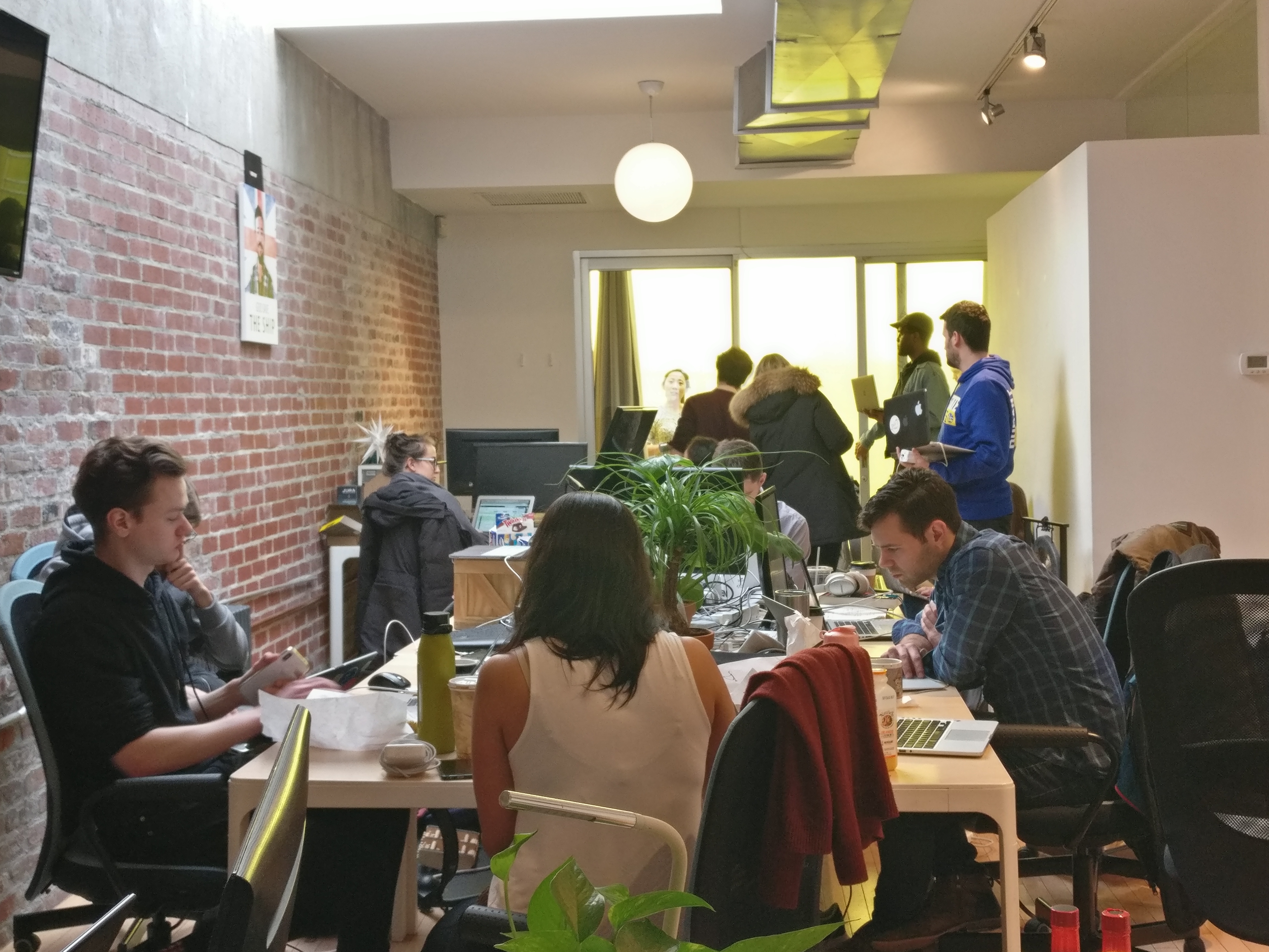 Michael Taylor working with a team in a co-working space